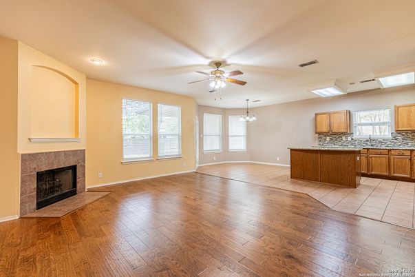 Empty room, Fireplace, Interior, Kitchen, Recessed Lighting, Wood Texture Flooring