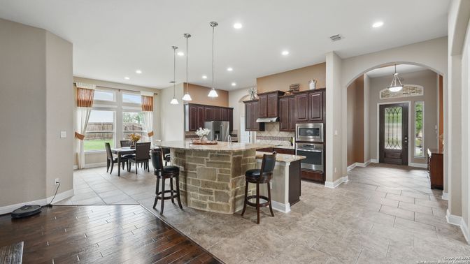 Dining room, Interior, Kitchen, Pendant Lights, Recessed Lighting, Stainless Steel Appliances, Wood Texture Flooring