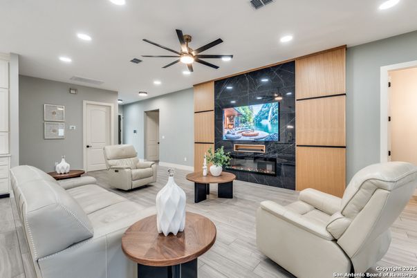Fireplace, Interior, Living room, Marble Walls, Recessed Lighting, Wood Texture Flooring