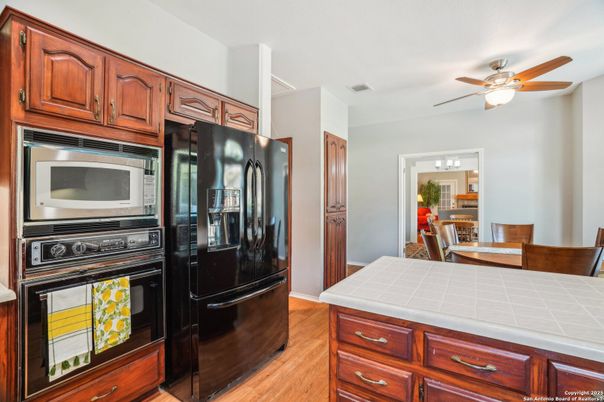 Dining room, Interior, Kitchen, Stainless Steel Appliances, Tile Countertops, Wood Texture Flooring