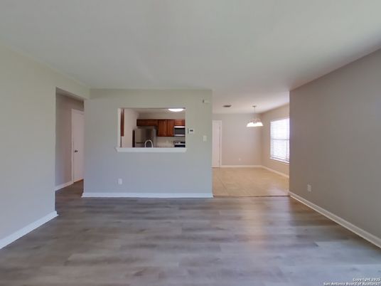 Chandelier, Empty room, Interior, Kitchen, Pendant Lights, Stainless Steel Appliances, Wood Texture Flooring