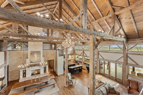 Chandelier, Fireplace, Interior, Living room, Stone Walls, Wooden Beams, Wooden Ceilings, Wood Texture Flooring