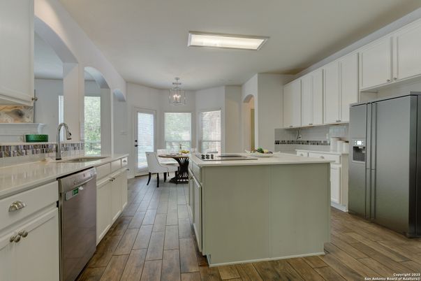 Dining room, Interior, Kitchen, Pendant Lights, Stainless Steel Appliances, Wood Texture Flooring