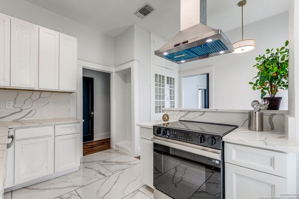 Interior, Kitchen, Marble, Marble Walls, Pendant Lights, Stainless Steel Appliances