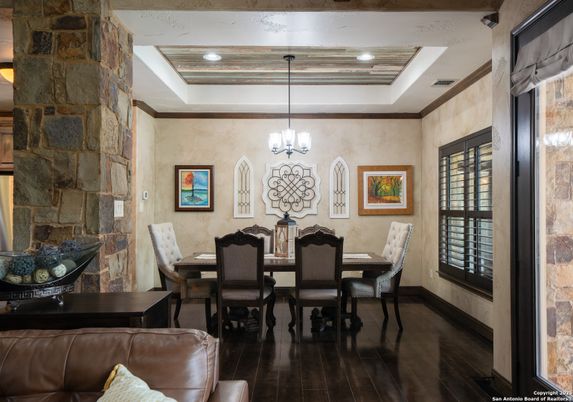Chandelier, Dining room, Interior, Pendant Lights, Recessed Lighting, Stone Walls, Wood Texture Flooring
