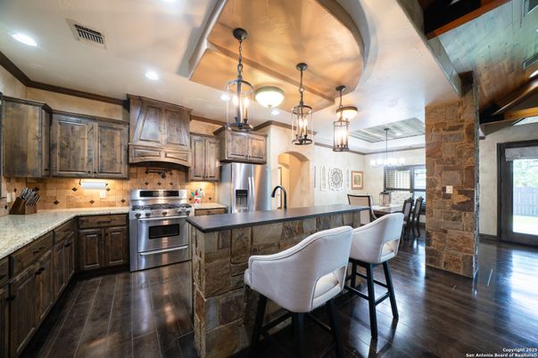 Dining room, Interior, Kitchen, Pendant Lights, Recessed Lighting, Stainless Steel Appliances, Wood Texture Flooring