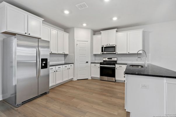Interior, Kitchen, Recessed Lighting, Stainless Steel Appliances, Wood Texture Flooring