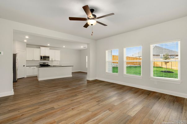 Empty room, Interior, Kitchen, Recessed Lighting, Stainless Steel Appliances, Wood Texture Flooring