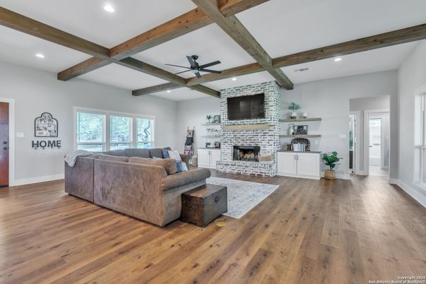 Fireplace, Interior, Living room, Recessed Lighting, Stone Walls, Wooden Beams, Wood Texture Flooring