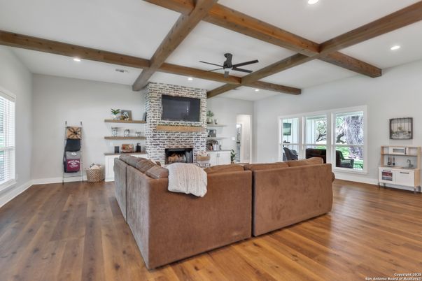 Fireplace, Interior, Living room, Recessed Lighting, Stone Walls, Wooden Beams, Wood Texture Flooring