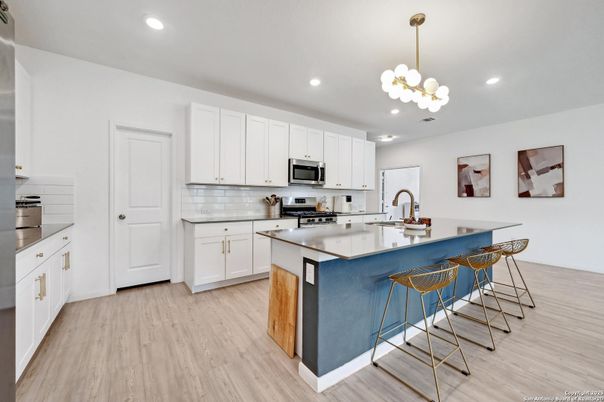 Chandelier, Interior, Kitchen, Pendant Lights, Recessed Lighting, Stainless Steel Appliances, Wood Texture Flooring