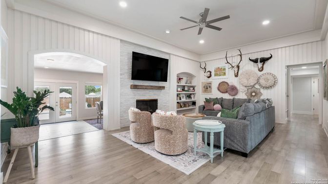Fireplace, Interior, Living room, Recessed Lighting, Stone Walls, Wood Texture Flooring