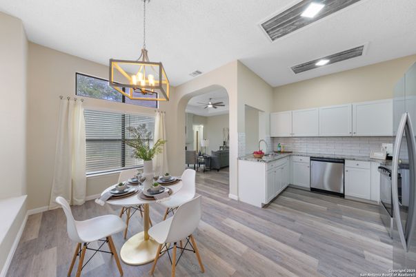Dining room, Interior, Kitchen, Pendant Lights, Recessed Lighting, Stainless Steel Appliances, Wood Texture Flooring