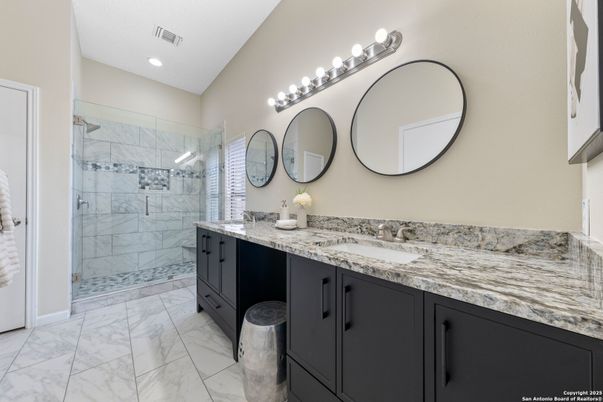 Bathroom, Dual Sink Vanities, Glass Shower, Interior, Marble, Marble Walls, Recessed Lighting