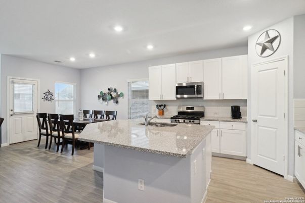 Dining room, Interior, Kitchen, Recessed Lighting, Stainless Steel Appliances, Wood Texture Flooring