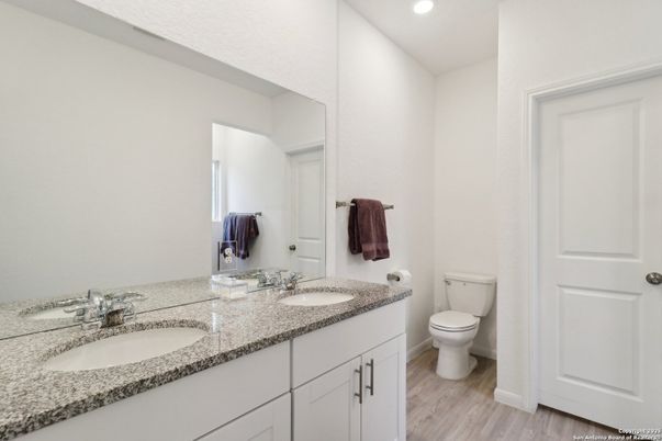 Bathroom, Dual Sink Vanities, Interior, Recessed Lighting, Wood Texture Flooring