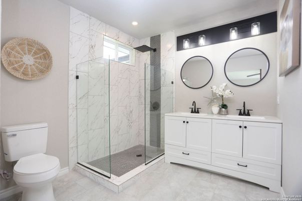 Bathroom, Dual Sink Vanities, Glass Shower, Interior, Marble Walls, Recessed Lighting
