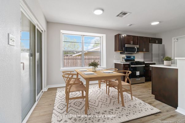 Dining room, Interior, Kitchen, Recessed Lighting, Stainless Steel Appliances, Wood Texture Flooring