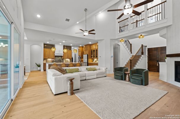 Fireplace, Interior, Kitchen, Living room, Pendant Lights, Recessed Lighting, Stainless Steel Appliances, Wood Texture Flooring