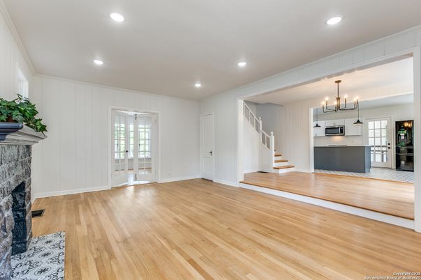 Empty room, Interior, Kitchen, Pendant Lights, Recessed Lighting, Stainless Steel Appliances, Wood Texture Flooring