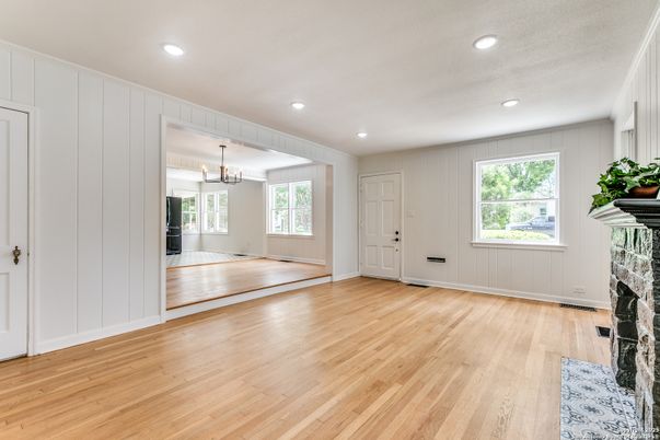 Chandelier, Empty room, Fireplace, Interior, Recessed Lighting, Wood Texture Flooring