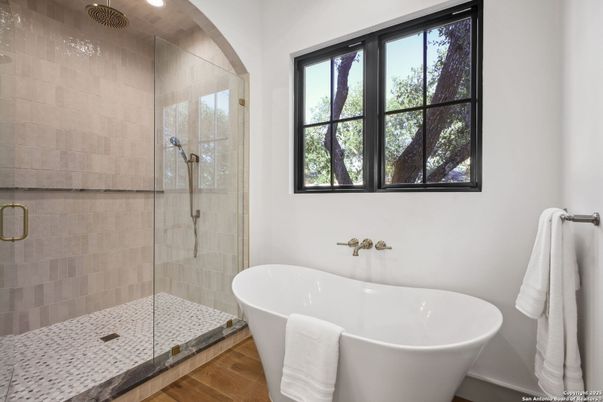 Bathroom, Free Standing Baths, Glass Shower, Interior, Recessed Lighting, Wood Texture Flooring