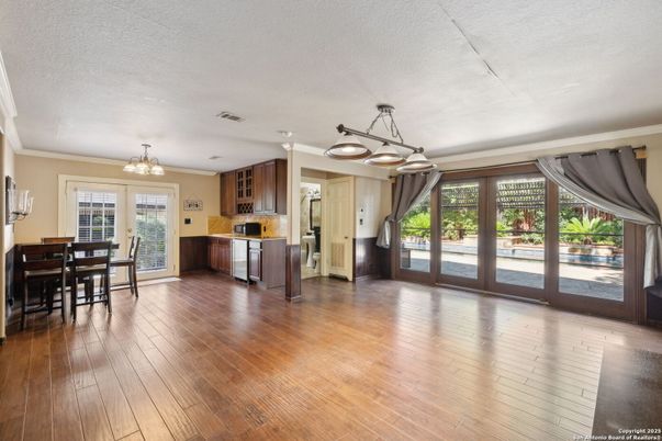 Chandelier, Dining room, Interior, Kitchen, Pendant Lights, Stainless Steel Appliances, Wood Texture Flooring