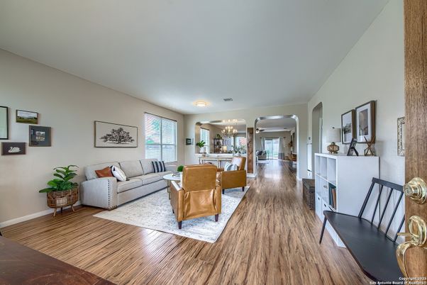 Dining room, Fireplace, Interior, Living room, Recessed Lighting, Wood Texture Flooring