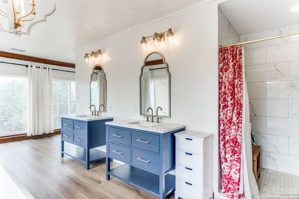 Bathroom, Dual Sink Vanities, Interior, Marble Walls, Wood Texture Flooring