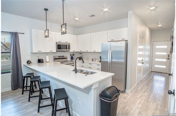 Interior, Kitchen, Pendant Lights, Recessed Lighting, Stainless Steel Appliances, Wood Texture Flooring