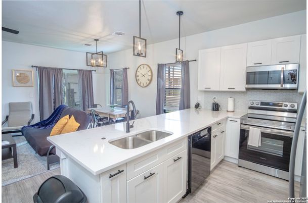 Dining room, Interior, Kitchen, Pendant Lights, Stainless Steel Appliances, Wood Texture Flooring