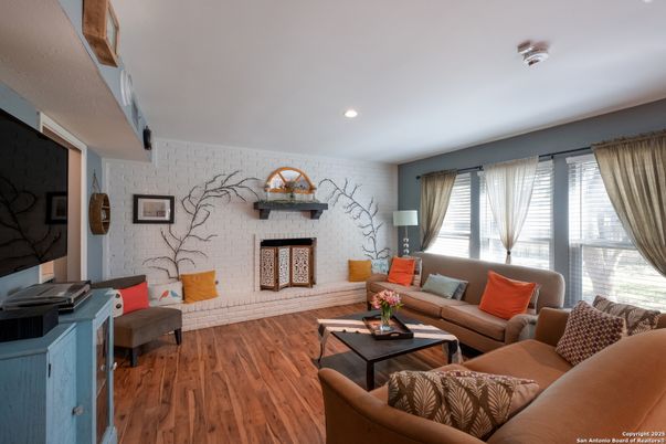 Fireplace, Interior, Living room, Recessed Lighting, Stone Walls, Wood Texture Flooring