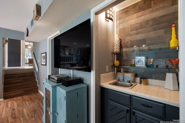 Interior, Kitchen, Tile Countertops, Wood Texture Flooring, Wooden Walls