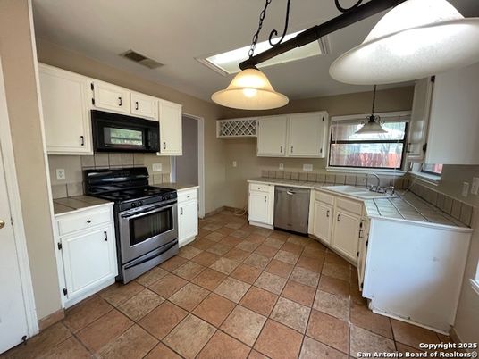 Interior, Kitchen, Pendant Lights, Stainless Steel Appliances, Tile Countertops
