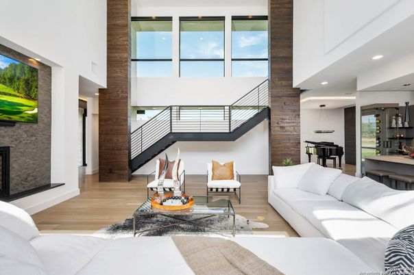 Fireplace, Interior, Living room, Pendant Lights, Piano, Recessed Lighting, Stone Walls, Wood Texture Flooring