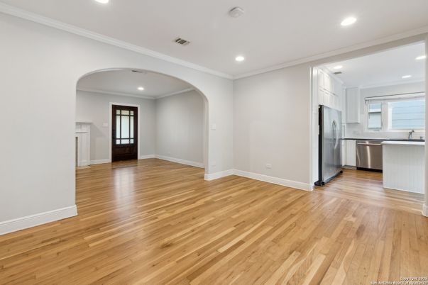 Empty room, Interior, Kitchen, Recessed Lighting, Stainless Steel Appliances, Wood Texture Flooring
