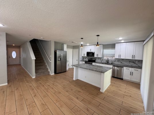 Interior, Kitchen, Pendant Lights, Recessed Lighting, Stainless Steel Appliances, Wood Texture Flooring