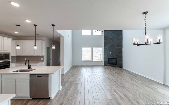 Chandelier, Fireplace, Interior, Kitchen, Pendant Lights, Recessed Lighting, Wood Texture Flooring