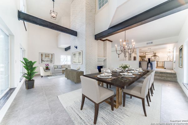 Chandelier, Dining room, Fireplace, Interior, Living room, Pendant Lights, Stone Walls, Wooden Beams
