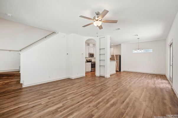 Empty room, Interior, Kitchen, Pendant Lights, Stainless Steel Appliances, Wood Texture Flooring