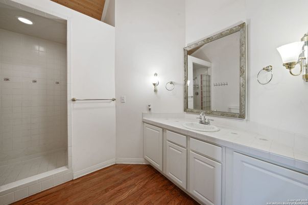 Bathroom, Dual Sink Vanities, Interior, Recessed Lighting, Tile Countertops, Wood Texture Flooring