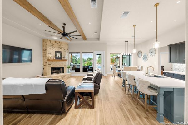 Dining room, Fireplace, Interior, Kitchen, Living room, Pendant Lights, Recessed Lighting, Stone Walls, Wooden Beams, Wood Texture Flooring