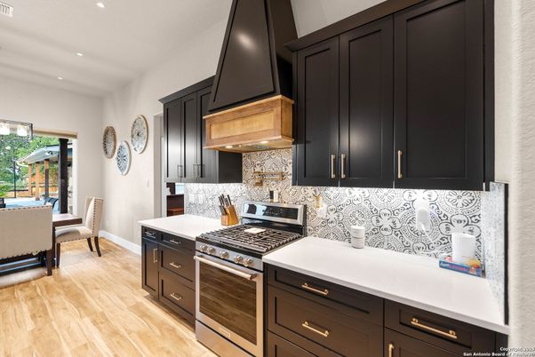 Dining room, Interior, Kitchen, Recessed Lighting, Stainless Steel Appliances, Wood Texture Flooring