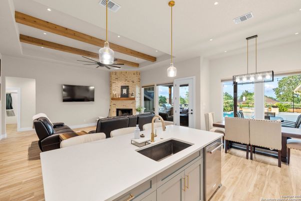 Dining room, Fireplace, Interior, Kitchen, Living room, Pendant Lights, Recessed Lighting, Stone Walls, Wooden Beams, Wood Texture Flooring
