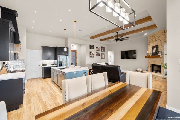 Dining room, Fireplace, Interior, Kitchen, Living room, Pendant Lights, Recessed Lighting, Stainless Steel Appliances, Stone Walls, Wood Texture Flooring