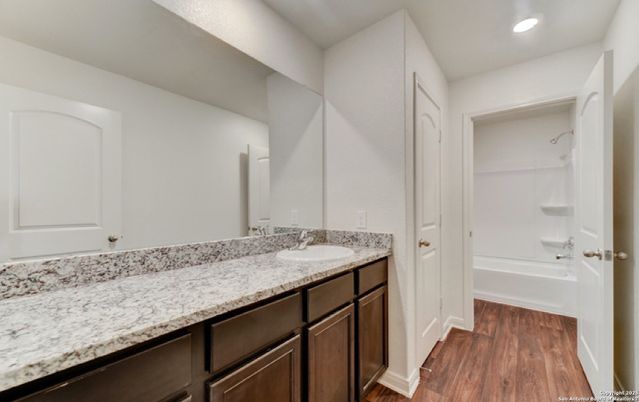 Bathroom, Dual Sink Vanities, Interior, Recessed Lighting, Wood Texture Flooring