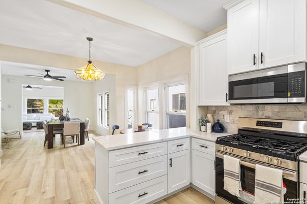 Dining room, Interior, Kitchen, Pendant Lights, Stainless Steel Appliances, Wood Texture Flooring