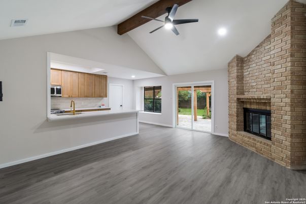 Empty room, Fireplace, Interior, Kitchen, Recessed Lighting, Stone Walls, Wooden Beams, Wood Texture Flooring