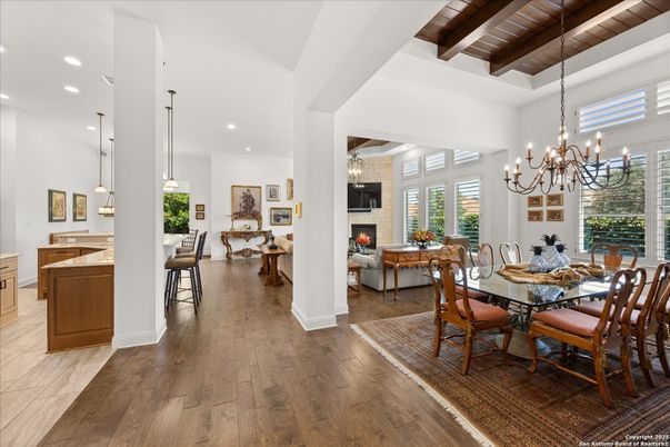 Chandelier, Dining room, Fireplace, Interior, Living room, Pendant Lights, Recessed Lighting, Wooden Beams, Wooden Ceilings, Wood Texture Flooring