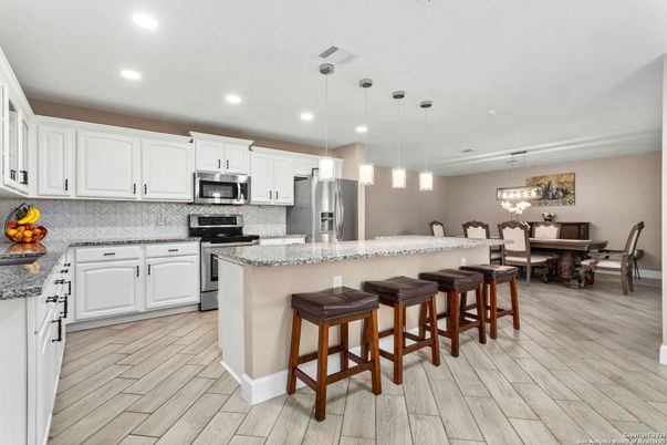 Dining room, Interior, Kitchen, Pendant Lights, Recessed Lighting, Stainless Steel Appliances, Wood Texture Flooring